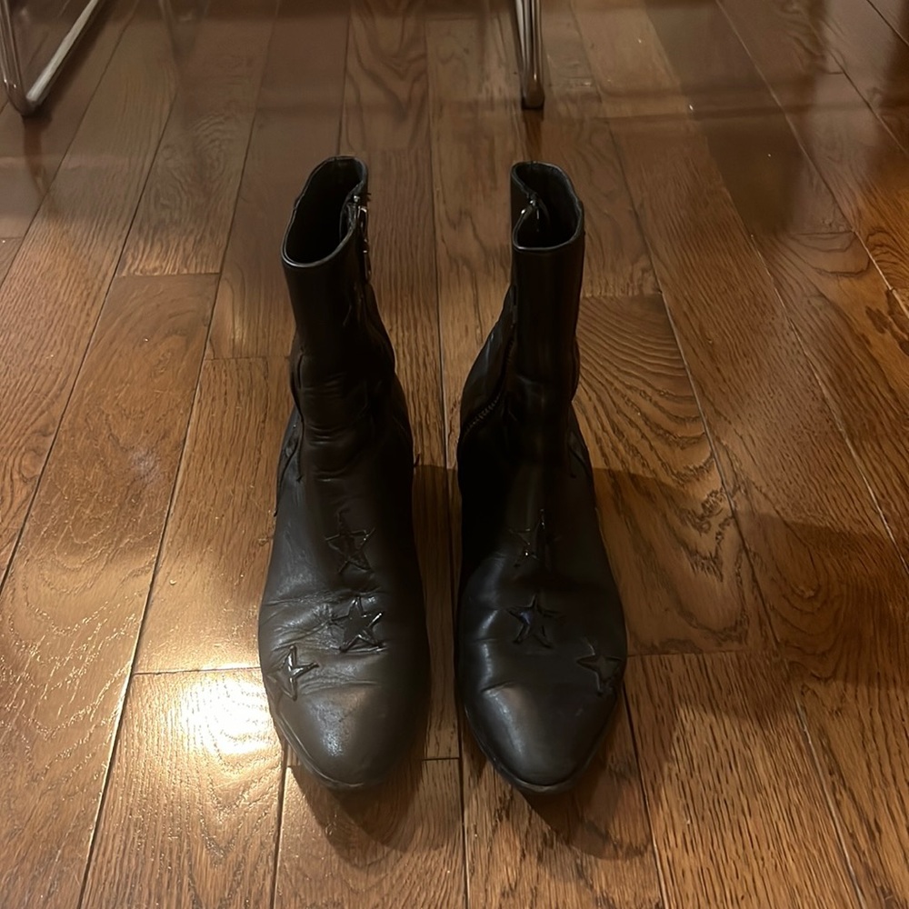 Modern vice black boots with star and lightening bolt detail, size 38